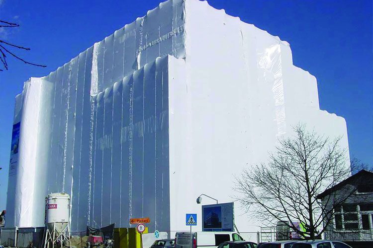 Under Construction Building Covered With PE Plastic for Safety